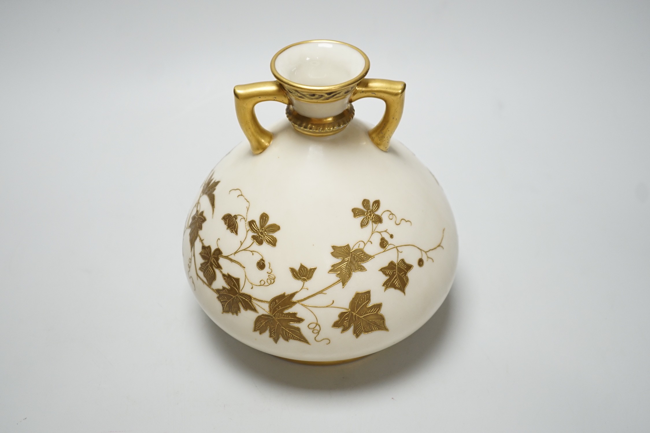 A Royal Worcester gilded vase of bulbous form, 17cm